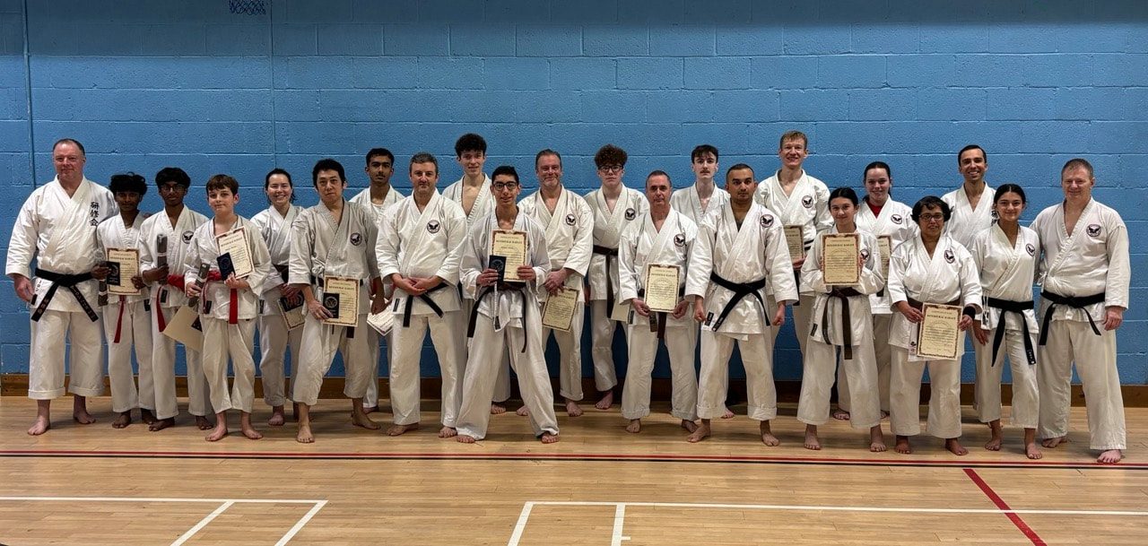 Senior students and instructors holding certificates after the senior grading, November 2025
